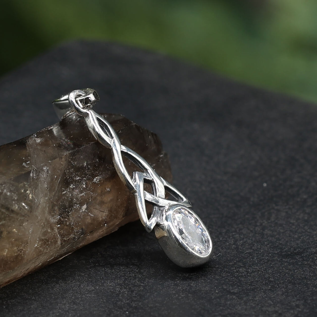Delicate Celtic knot pendant set with a clear cubic zirconia crystal in 925 silver
